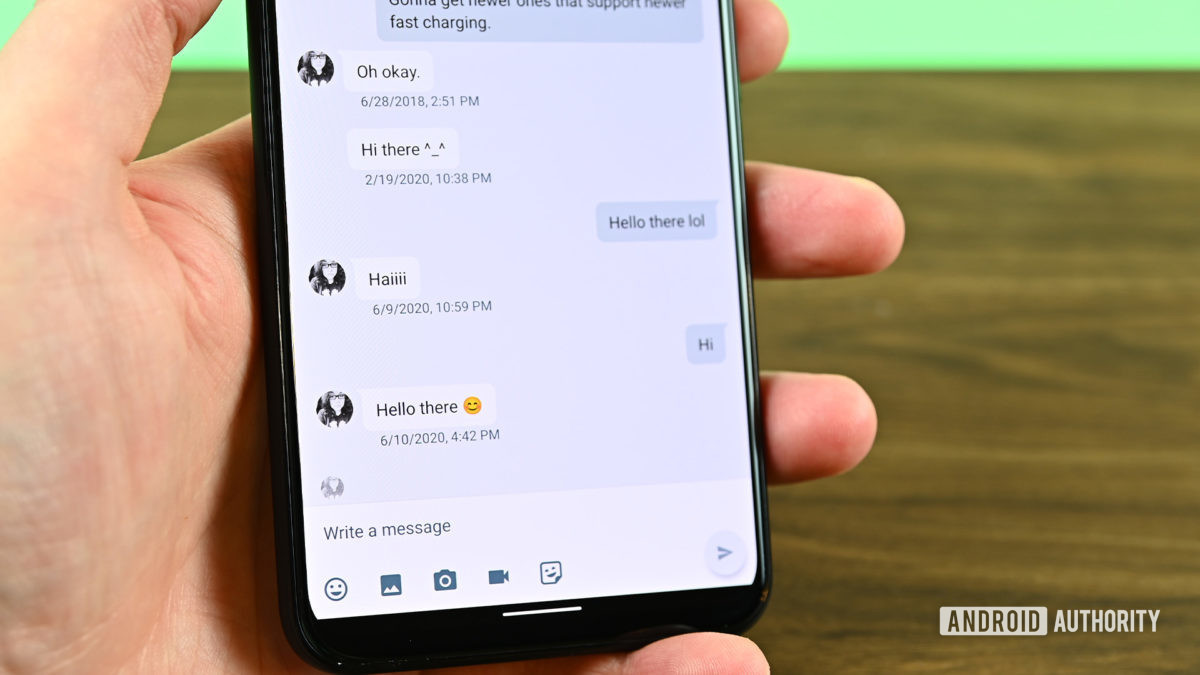 Google Hangouts chat screen on phone in hand.