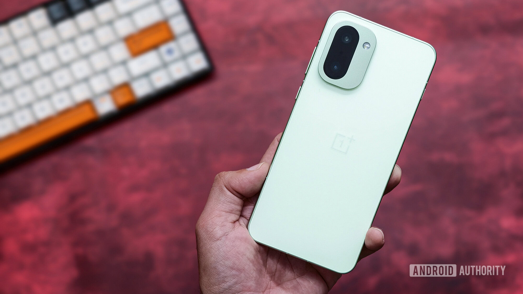 OnePlus 15R green held in hand