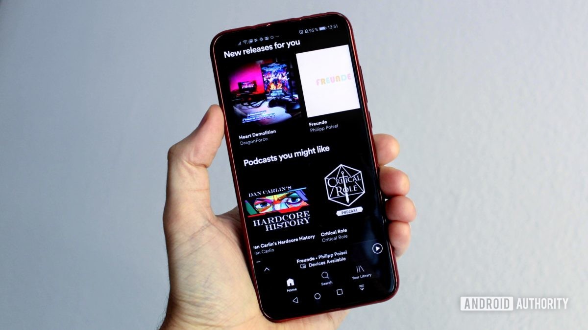 Spotify menu on a smartphone in a person's hand